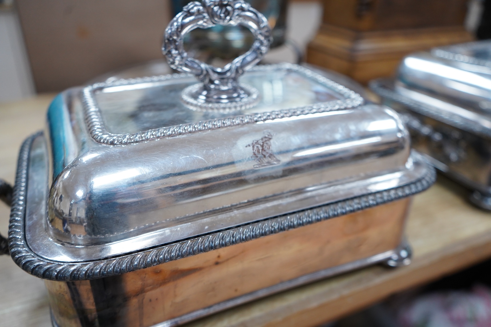 A pair of silver plated entrée dishes, an egg coddler and salver